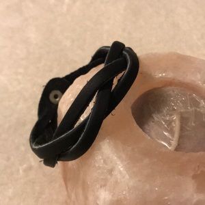 Black braided leather bracelet.